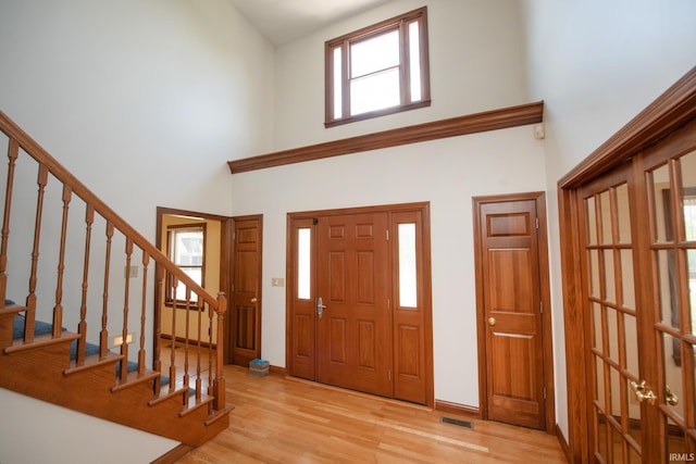 3827 Sunnycroft Pl, West Lafayette, IN 47906 - foyer with a high ceiling, wood finished floors, stairs, and french doors