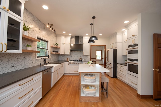 3827 Sunnycroft Pl, West Lafayette, IN 47906 - kitchen with open shelves, stainless steel appliances, wall chimney exhaust hood, backsplash, and white cabinetry