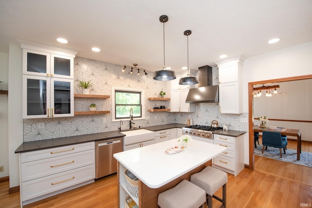 3827 Sunnycroft Pl, West Lafayette, IN 47906 - kitchen featuring open shelves, stainless steel appliances, wall chimney range hood, white cabinets, and tasteful backsplash