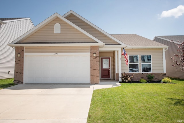 6471 Wallingford St, Lafayette, IN 47905 - view of front of house with brick siding, driveway, an attached garage, and a front yard