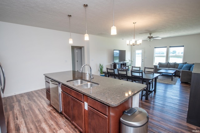 6471 Wallingford St, Lafayette, IN 47905 - kitchen with dishwasher, dark wood-style floors, a ceiling fan, open floor plan, and a textured ceiling