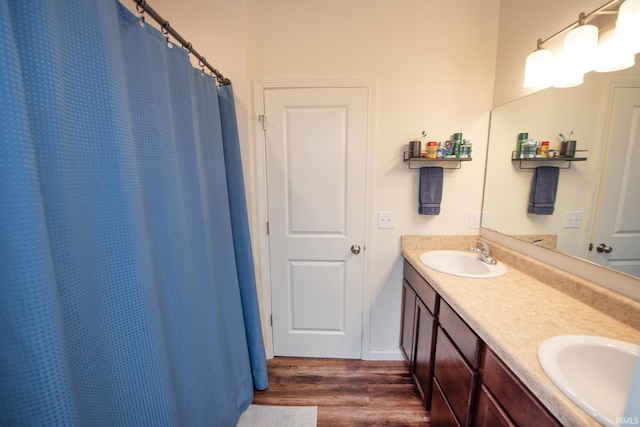 6471 Wallingford St, Lafayette, IN 47905 - full bathroom featuring wood finished floors and double vanity