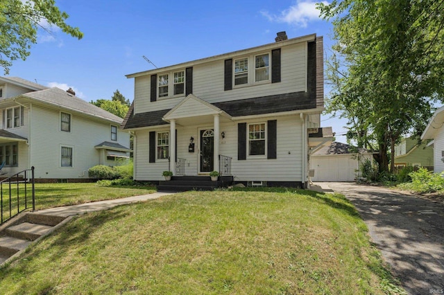 412 Tonti Ave, South Bend, IN 46617 - view of front of home with a chimney, a garage, a front lawn, roof with shingles, and an outdoor structure