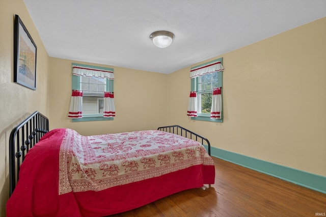 412 Tonti Ave, South Bend, IN 46617 - bedroom featuring wood finished floors and multiple windows