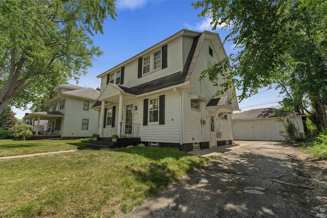 412 Tonti Ave, South Bend, IN 46617 - view of front of home with an outbuilding, a front yard, a garage, a gambrel roof, and roof with shingles