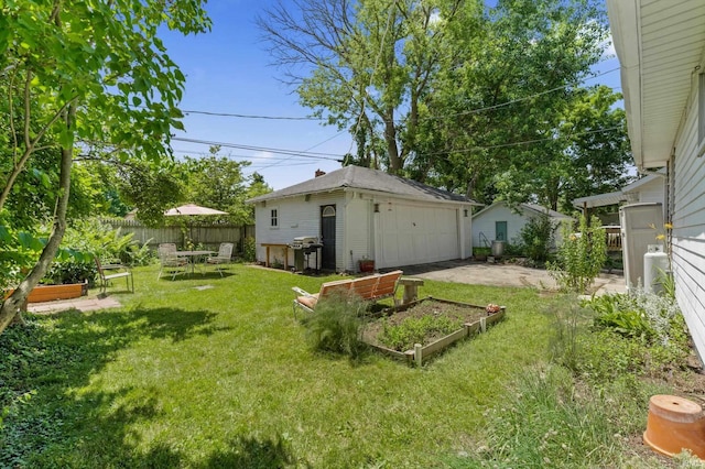 412 Tonti Ave, South Bend, IN 46617 - view of yard with a vegetable garden, a detached garage, and an outdoor structure