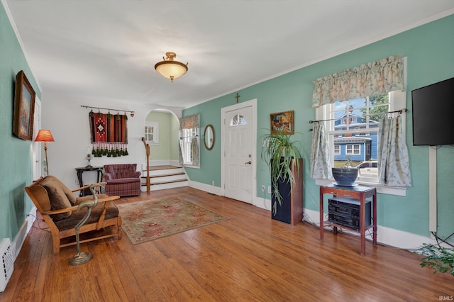412 Tonti Ave, South Bend, IN 46617 - entryway featuring arched walkways, wood finished floors, ornamental molding, and stairway