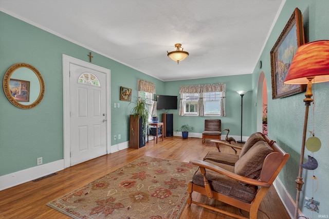 412 Tonti Ave, South Bend, IN 46617 - living area with wood finished floors, ornamental molding, and arched walkways