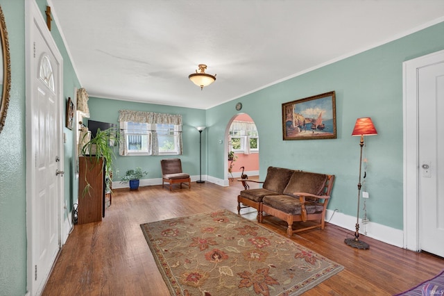 412 Tonti Ave, South Bend, IN 46617 - living area featuring wood finished floors, arched walkways, and ornamental molding