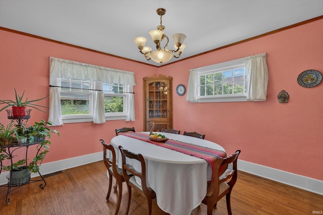 412 Tonti Ave, South Bend, IN 46617 - dining area featuring a chandelier, crown molding, and wood finished floors