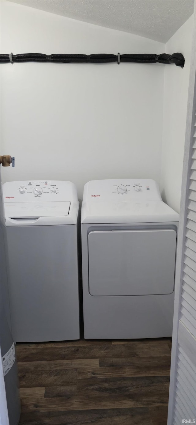 589 Graves Addn Rd, Bedford, IN 47421 - laundry area featuring separate washer and dryer and dark wood-type flooring