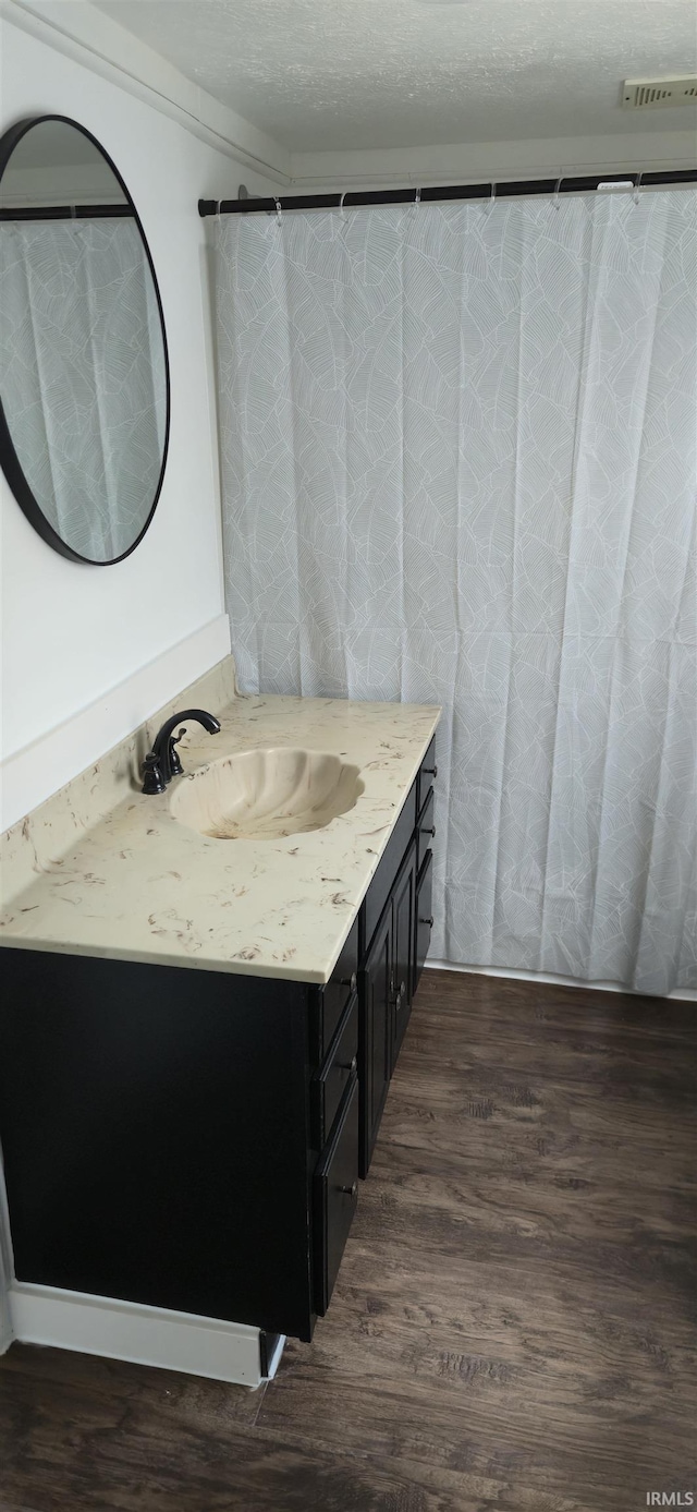 589 Graves Addn Rd, Bedford, IN 47421 - full bathroom with vanity and wood finished floors