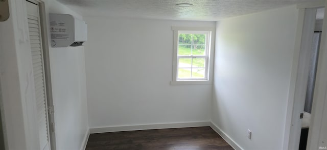 589 Graves Addn Rd, Bedford, IN 47421 - empty room with dark wood-style flooring and a textured ceiling