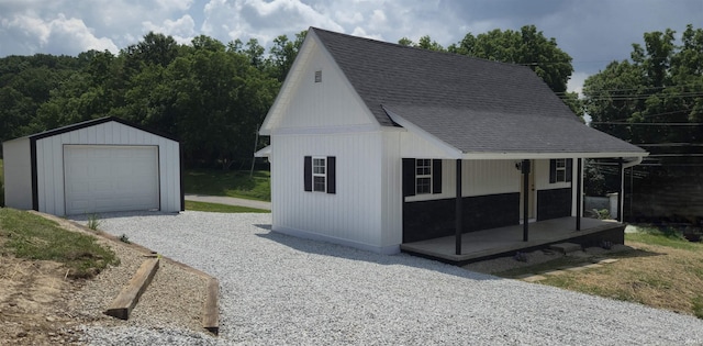 589 Graves Addn Rd, Bedford, IN 47421 - detached garage featuring driveway and covered porch
