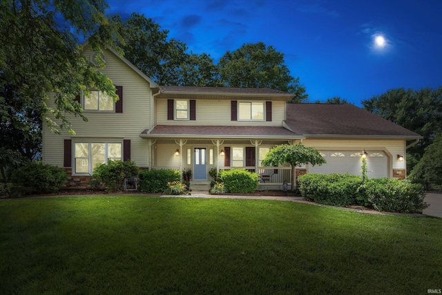 51769 S Saddle Ridge Ln, Granger, IN 46530 - traditional-style home featuring covered porch, a front lawn, a garage, and driveway