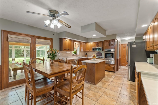 51769 S Saddle Ridge Ln, Granger, IN 46530 - dining area featuring ceiling fan, light tile patterned flooring, a textured ceiling, and recessed lighting