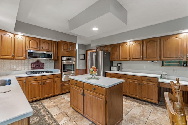 51769 S Saddle Ridge Ln, Granger, IN 46530 - kitchen featuring appliances with stainless steel finishes, a warming drawer, brown cabinetry, light countertops, and recessed lighting