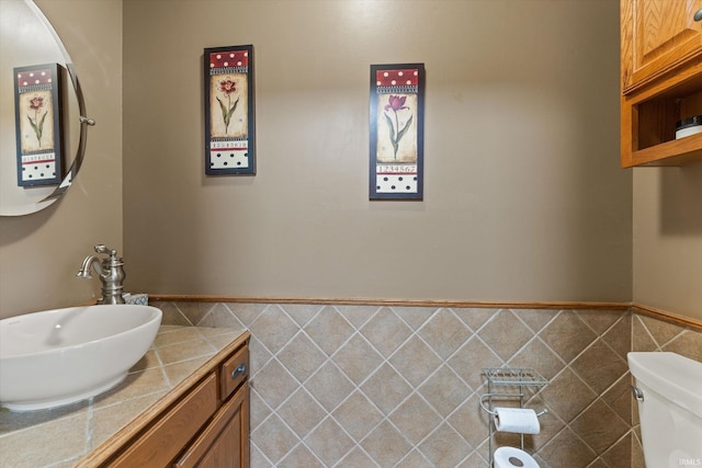 51769 S Saddle Ridge Ln, Granger, IN 46530 - half bathroom with vanity and tile walls
