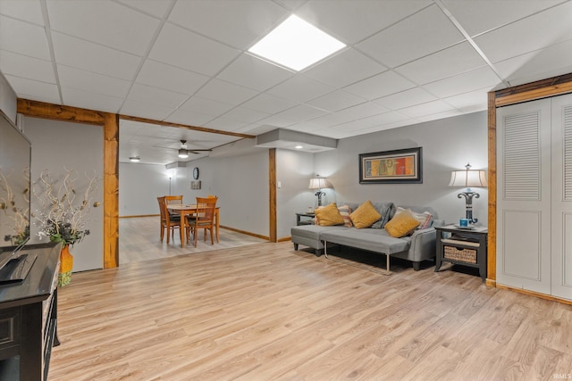 51769 S Saddle Ridge Ln, Granger, IN 46530 - living room featuring light wood-style flooring, a drop ceiling, and ceiling fan