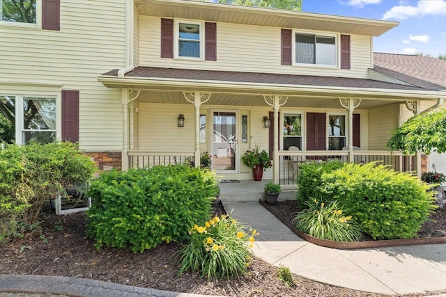 51769 S Saddle Ridge Ln, Granger, IN 46530 - view of front facade featuring covered porch and a shingled roof
