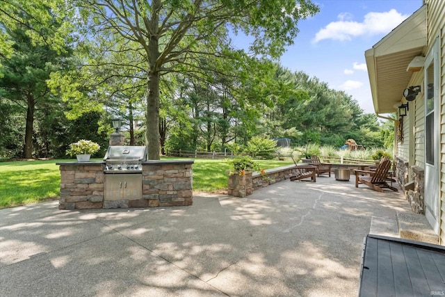 51769 S Saddle Ridge Ln, Granger, IN 46530 - view of patio / terrace featuring area for grilling and view of wooded area