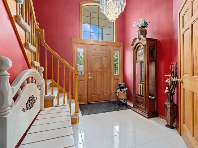 6709 Shag Bark Ct, Fort Wayne, IN 46835 - entryway featuring a chandelier, stairs, and a high ceiling