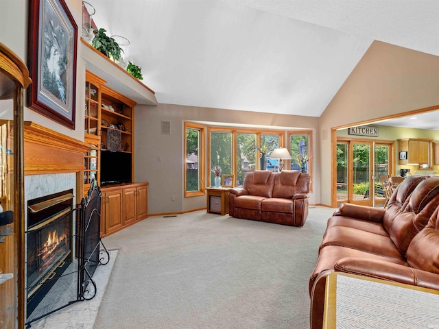 6709 Shag Bark Ct, Fort Wayne, IN 46835 - living area with high vaulted ceiling, a glass covered fireplace, light colored carpet, and plenty of natural light