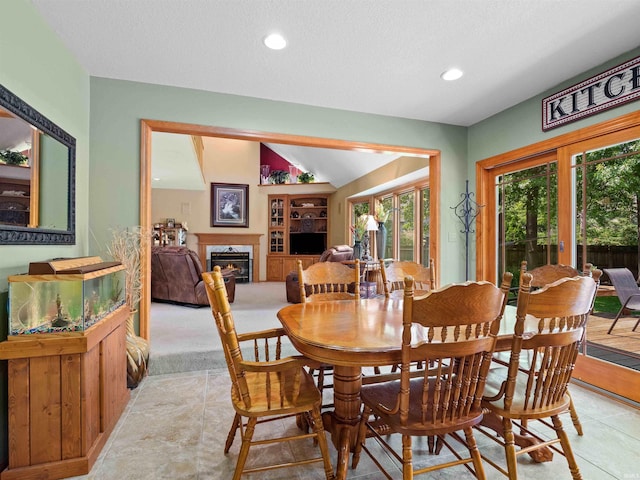 6709 Shag Bark Ct, Fort Wayne, IN 46835 - dining space with a high end fireplace, recessed lighting, light tile patterned floors, vaulted ceiling, and built in shelves