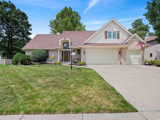 6709 Shag Bark Ct, Fort Wayne, IN 46835 - view of front facade with brick siding, concrete driveway, and a garage