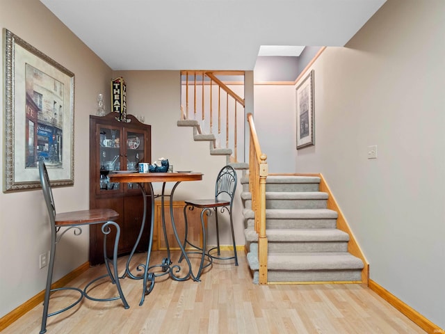 6709 Shag Bark Ct, Fort Wayne, IN 46835 - stairway with wood finished floors and baseboards