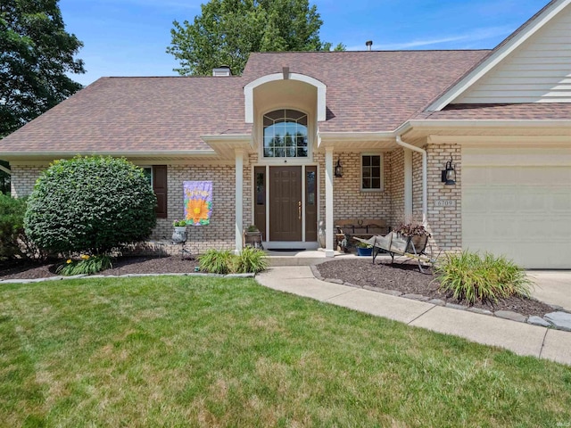 6709 Shag Bark Ct, Fort Wayne, IN 46835 - view of front of home with roof with shingles, brick siding, a front yard, and an attached garage