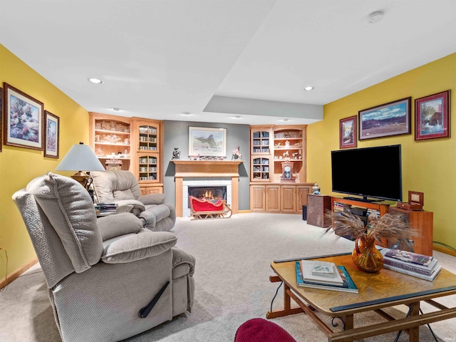 6709 Shag Bark Ct, Fort Wayne, IN 46835 - carpeted living room featuring built in shelves, recessed lighting, and a fireplace