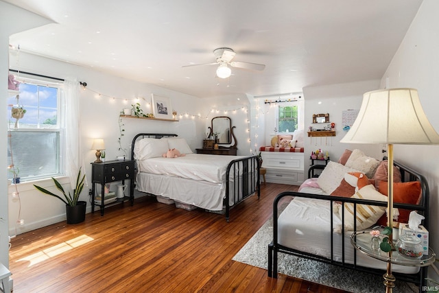 1521 E Beardsley Ave, Elkhart, IN 46514 - bedroom with wood-type flooring, multiple windows, and a ceiling fan