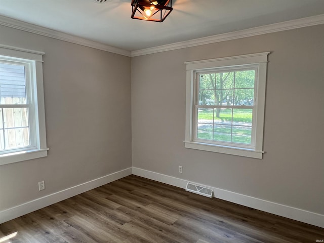 1503 W Ave, Goshen, IN 46526 - unfurnished room featuring healthy amount of natural light, crown molding, and dark wood-style flooring
