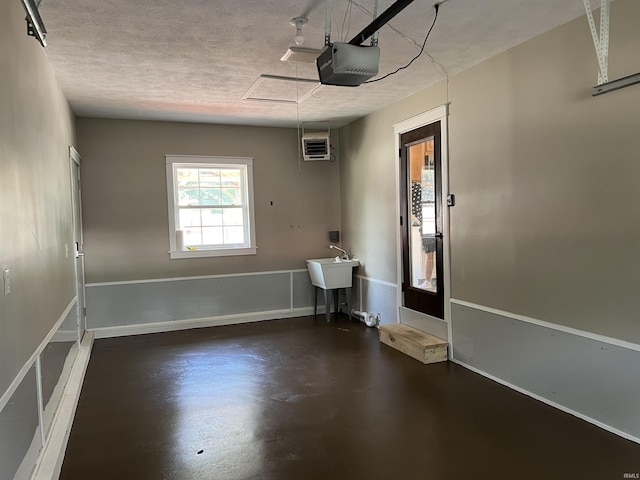 1503 W Ave, Goshen, IN 46526 - garage with a garage door opener and a sink