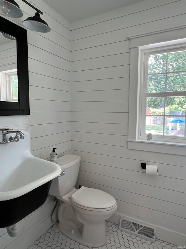 1503 W Ave, Goshen, IN 46526 - half bath with wooden walls and tile patterned flooring