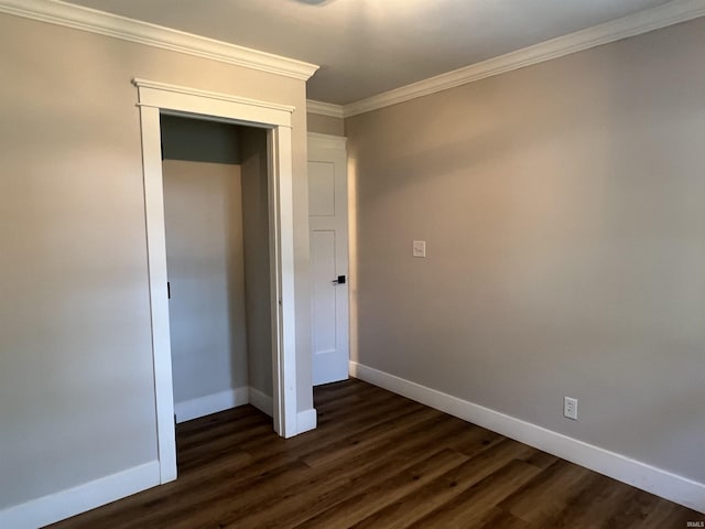 1503 W Ave, Goshen, IN 46526 - unfurnished bedroom featuring crown molding, dark wood-type flooring, and a closet
