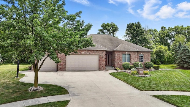 1208 Phaeton Way, Auburn, IN 46706 - view of front of house with brick siding, an attached garage, a front lawn, and concrete driveway