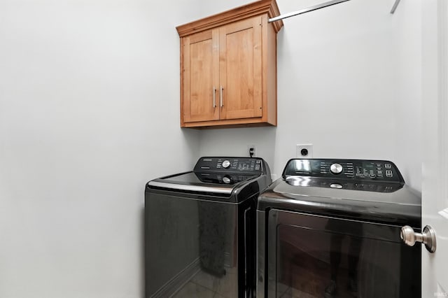 1208 Phaeton Way, Auburn, IN 46706 - laundry area featuring washer and clothes dryer and cabinet space