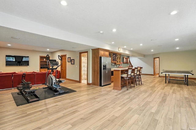 1208 Phaeton Way, Auburn, IN 46706 - workout area featuring bar with sink, light wood-type flooring, and recessed lighting