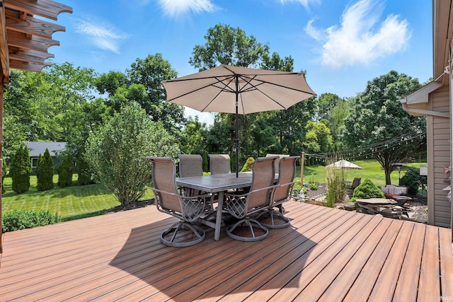 1208 Phaeton Way, Auburn, IN 46706 - wooden deck featuring outdoor dining area, a lawn, and view of scattered trees
