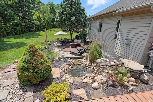 1208 Phaeton Way, Auburn, IN 46706 - view of green lawn with a patio