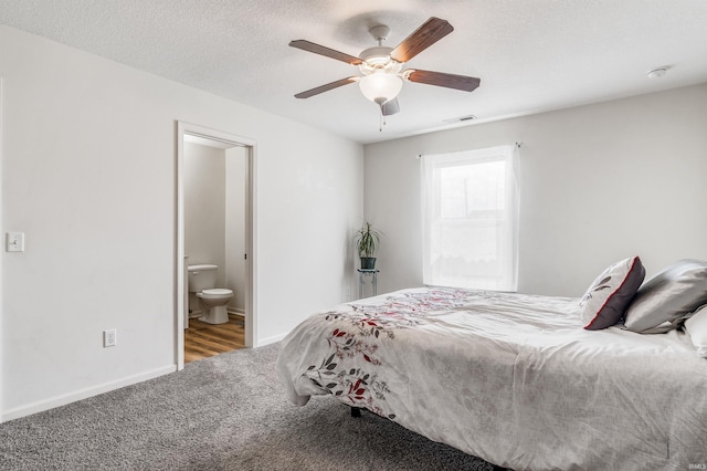 12909 Cocoplum Ct, Fort Wayne, IN 46814 - carpeted bedroom with ensuite bath and a ceiling fan