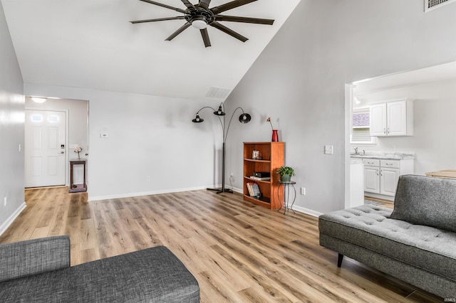 12909 Cocoplum Ct, Fort Wayne, IN 46814 - living room with a ceiling fan, light wood-style flooring, and high vaulted ceiling