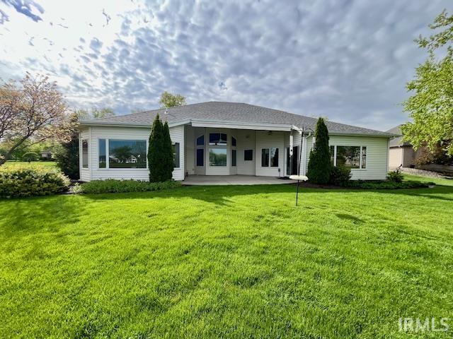 8018 Inverness Lakes Trl, Fort Wayne, IN 46804 - rear view of property with a patio and a lawn