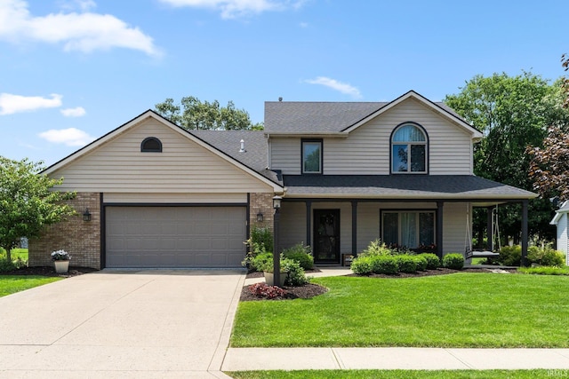 9628 Trading Post Rd, Leo, IN 46765 - view of front of property featuring a front yard, an attached garage, driveway, a shingled roof, and brick siding