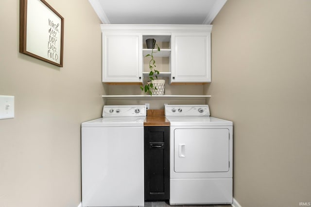 9628 Trading Post Rd, Leo, IN 46765 - laundry area with cabinet space, washer and dryer, and crown molding