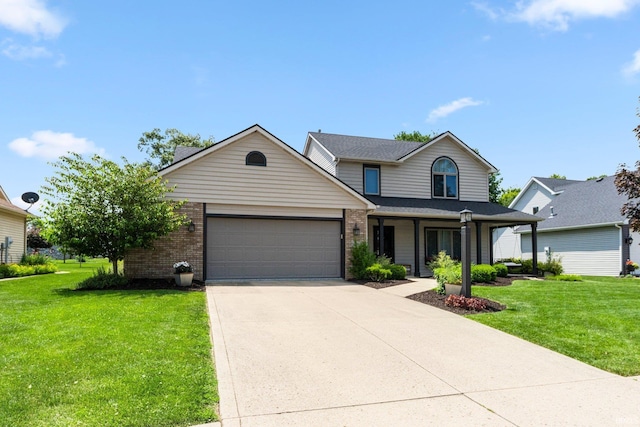 9628 Trading Post Rd, Leo, IN 46765 - view of front of property with a front lawn, an attached garage, concrete driveway, and brick siding