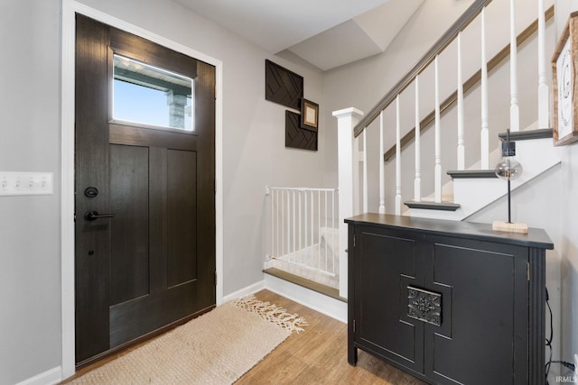 9628 Trading Post Rd, Leo, IN 46765 - foyer featuring light wood finished floors and stairs