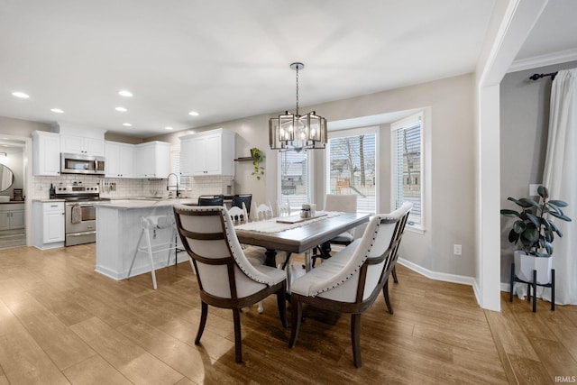 9628 Trading Post Rd, Leo, IN 46765 - dining area with a chandelier, light wood-type flooring, and recessed lighting